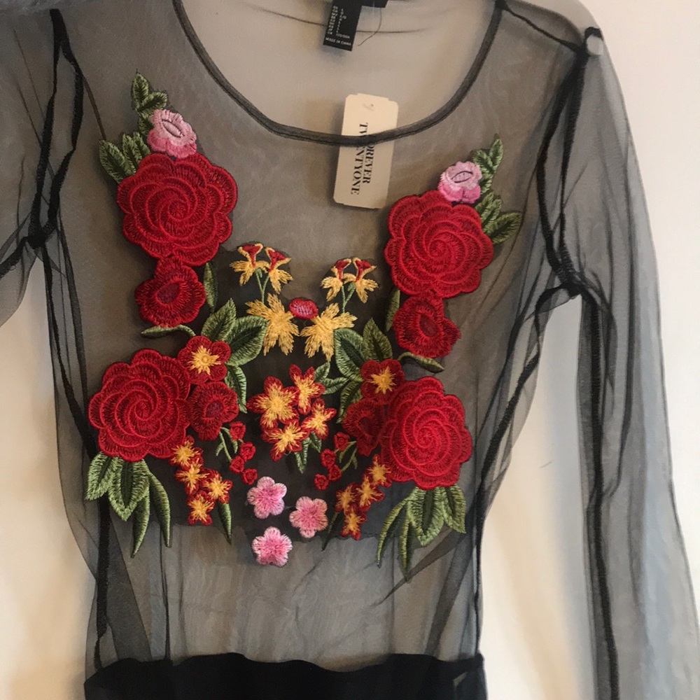 Floral mesh long sleeved body suit